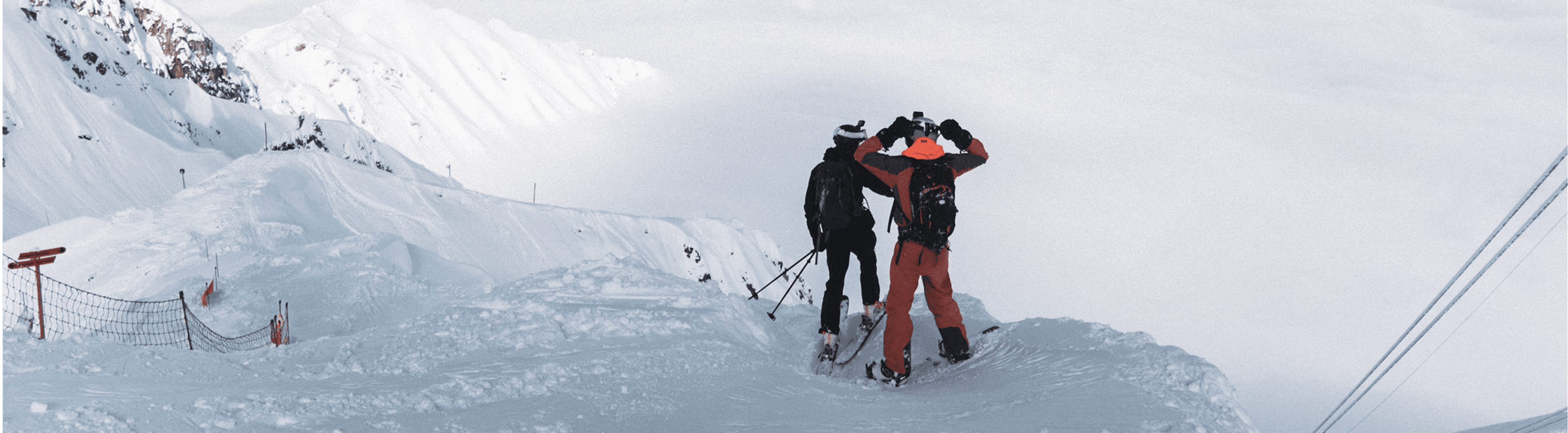 Skiers on a snowy ridge